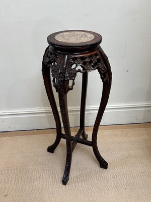 Lot 2701 - A Chinese carved rosewood jardinière stand...