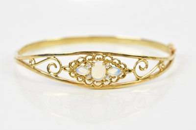 Lot 438 - A 9ct yellow gold moonstone and diamond hinged...