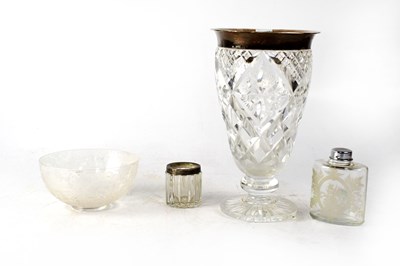 Lot 635 - A cut glass baluster vase with hallmarked silver rim