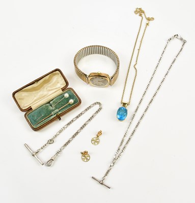 Lot 285 - A yellow metal pendant mounted with a pale...
