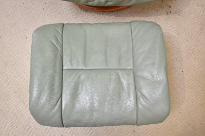 Lot 43 - STRESSLESS; a leather armchair with stool.