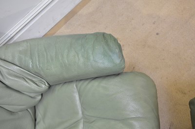 Lot 43 - STRESSLESS; a leather armchair with stool.