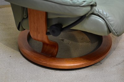 Lot 43 - STRESSLESS; a leather armchair with stool.
