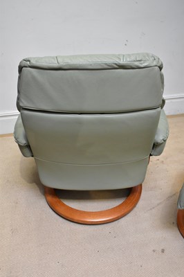 Lot 43 - STRESSLESS; a leather armchair with stool.