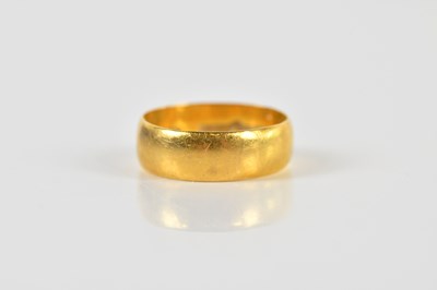 Lot 1383 - A 22ct yellow gold wedding band, inscribed...