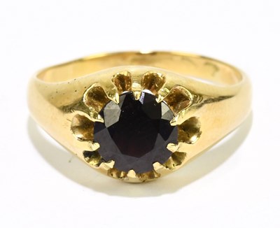Lot 1162 - A yellow metal garnet set signet ring, size Q,...
