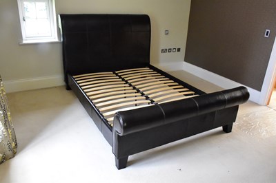 Lot 1228 - A contemporary dark brown leather effect king...