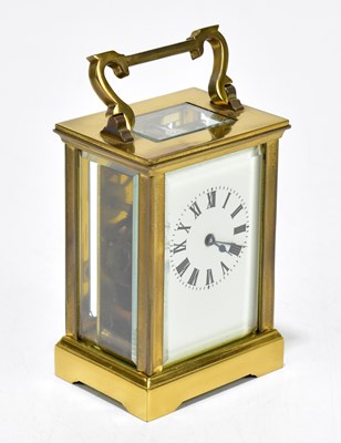 Lot 1463 - A brass cased carriage clock with rectangular white enamel dial set with Roman numerals