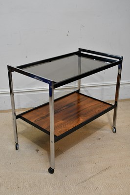 Lot 1008 - HOWARD MILLER; a retro chrome two tier trolley...