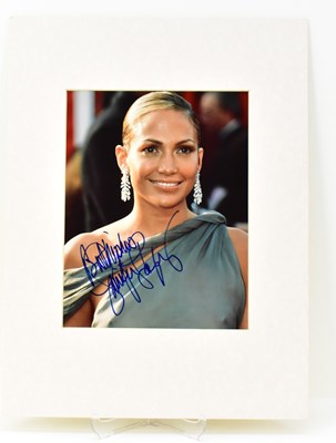 Lot 1681 - JENNIFER LOPEZ; a mounted signed colour...