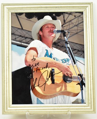 Lot 1738 - ALAN JACKSON; a framed signed photograph of...