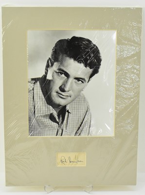 Lot 1716 - ROCK HUDSON; a mounted black and white...