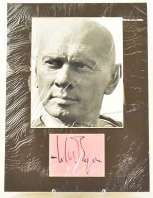 Lot 1718 - YUL BRYNNER; a mounted display depicting a...