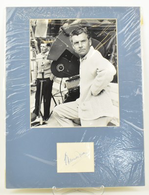 Lot 1719 - KENNETH MORE; a mounted display featuring a...
