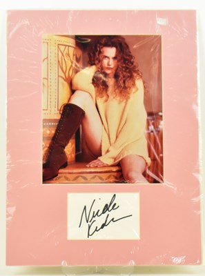 Lot 1720 - NICOLE KIDMAN; a mounted display featuring a...