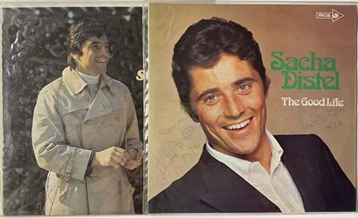 Lot 1693 - SACHA DISTEL; two signed albums comprising...