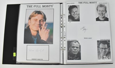 Lot 1539 - A large black folder containing signed pages...