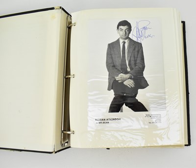 Lot 1570 - A large full black album including signed...