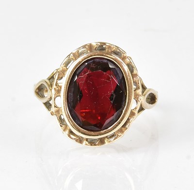 Lot 613 - A 9ct yellow gold ring set with large facet...