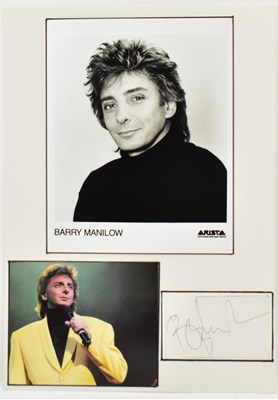 Lot 1810 - BARRY MANILOW; a display featuring a black and...