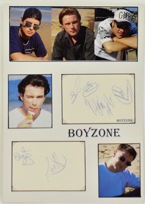 Lot 1811 - BOYZONE; a display featuring colour photo...