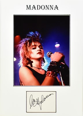 Lot 1812 - MADONNA; a display featuring a colour photo...