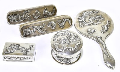 Lot 2231 - A Chinese white metal four piece dressing...