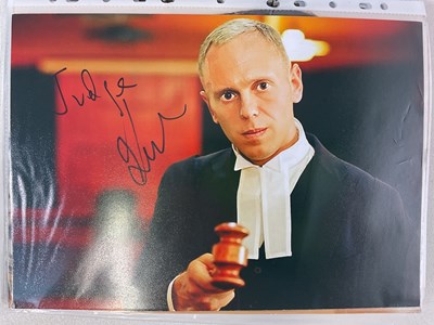 Lot 1572 - A black folder containing autographed black...
