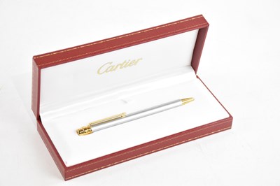 Lot 1930 - CARTIER; a stainless steel and gold tone Must...