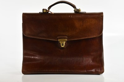 Lot 663 - THE BRIDGE; a large tan leather briefcase,...