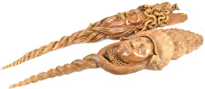Lot 149 - Two large and impressive heavy carved wooden wall masks