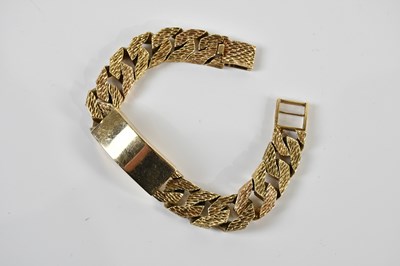 Lot 1528 - A substantial 9ct textured yellow gold wide...