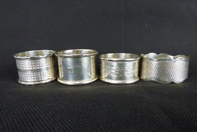 Lot 657 - Four hallmarked silver napkin rings