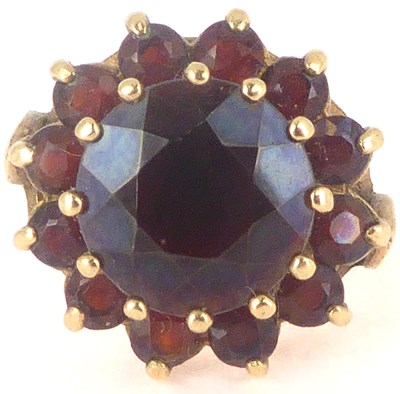 Lot 764 - A 9ct gold garnet cluster ring, the large...