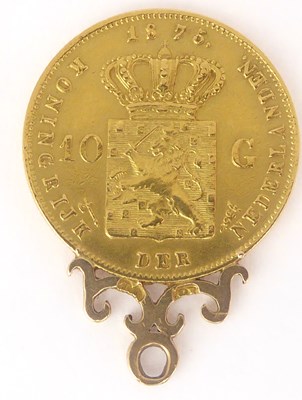Lot 698a - An 1875 G Netherlands coin in mount.