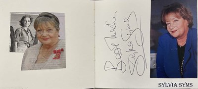 Lot 1598 - An autograph album containing pages signed by...