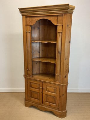 Lot 823 - A pine corner floor standing corner cupboard...