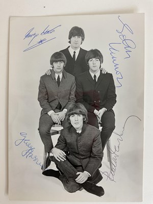 Lot 1527 - THE BEATLES; an original black and white...