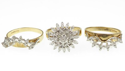 Lot 953 - A 9ct gold three-piece diamond cluster bridal...