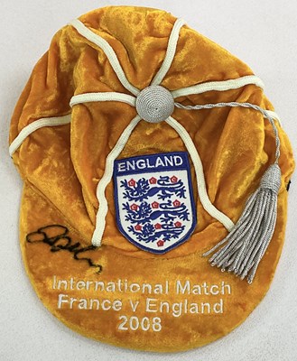 Lot 1937 - DAVID BECKHAM; an orange velvet England cap...