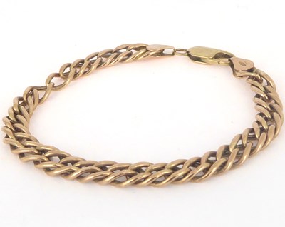 Lot 798 - A tight curb link bracelet with lobster claw...