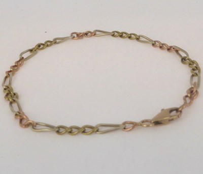 Lot 800 - A 9ct gold white and rose gold figaro link...