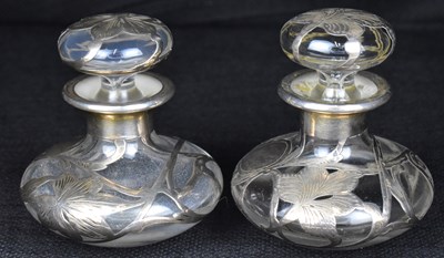 Lot 664 - Two Art Nouveau silver and glass perfume decanters