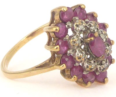 Lot 757 - A 9ct gold ruby and white stone cluster ring