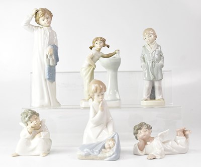 Lot 192 - LLADRÓ; six figures comprising three cherubs,...