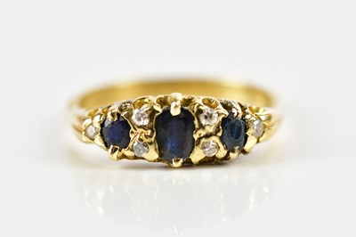 Lot 1458 - An 18ct yellow gold sapphire and diamond ring...