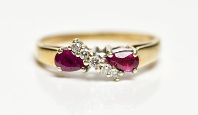 Lot 1460 - A 9ct yellow gold ruby and diamond ring, size...