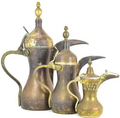 Lot 190 - A graduated set of three 20th century Turkish handcrafted kettles