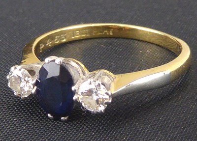 Lot 748 - An 18ct gold diamond and sapphire ring