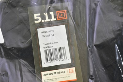 Lot 43 - TACTICAL; a pair of black relaxed fit pro...
